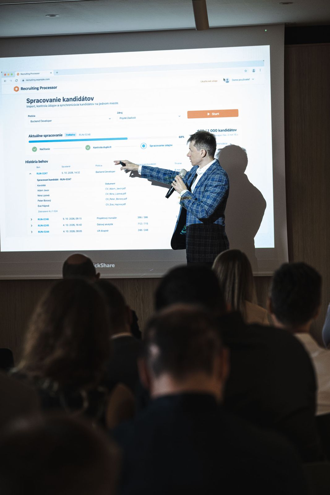 Michal Juhás showing a candidate-processing app on the big screen